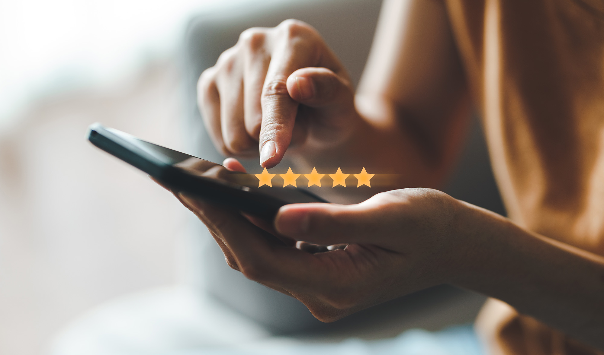 Close up of woman customer giving a five star rating on smartphone. Review, Service rating, satisfaction, Customer service experience and satisfaction survey concept.